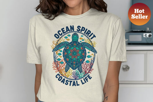 T-shirt with sea turtle, fish, coral, and "Ocean Spirit Coastal Life" text.